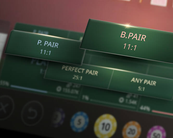 Close-up image of a gaming table with betting options displayed, including 'P. PAIR' at 11:1, 'B. PAIR' at 11:1, 'PERFECT PAIR' at 7:2, and 'ANY PAIR' at 7:2, with colorful chips in the background.